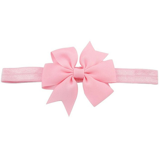 Roze baby haarbandje met strik